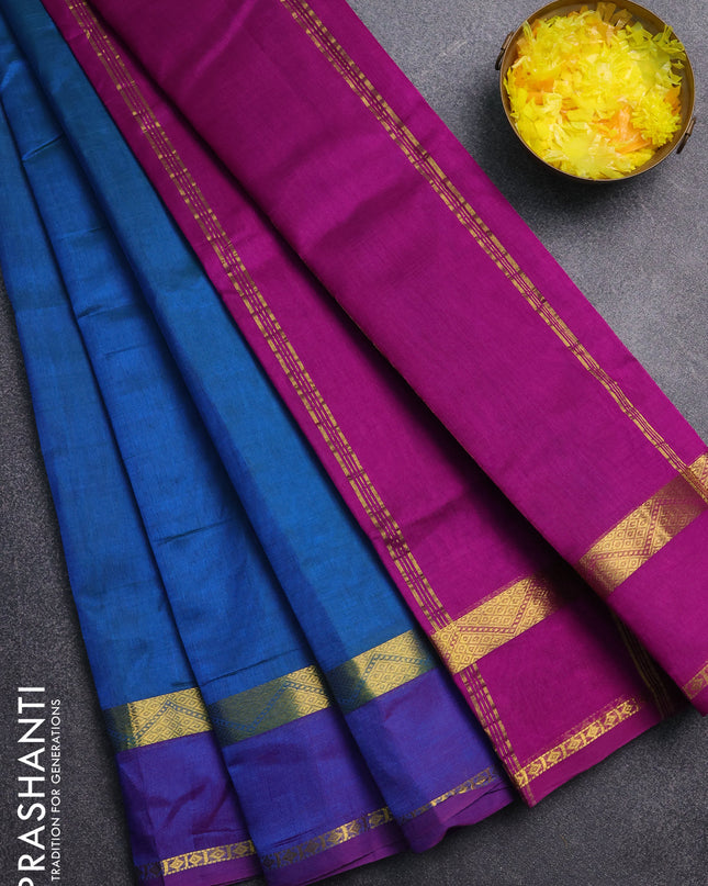 Silk cotton saree teal blue and purple with plain body and zari woven border
