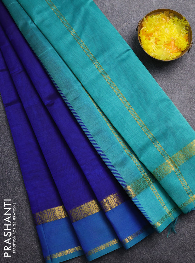 Silk cotton saree blue and teal green with plain body and zari woven border
