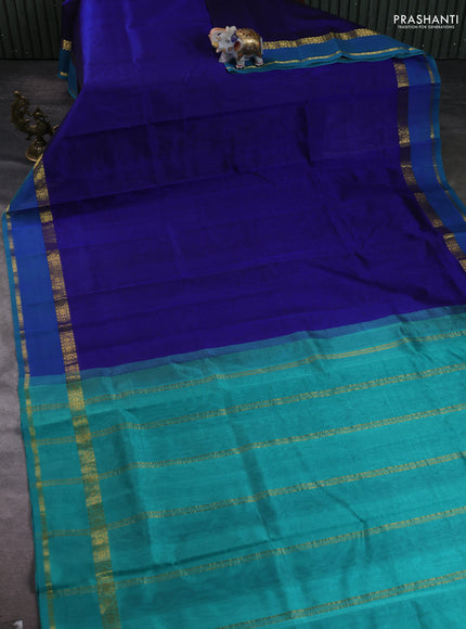 Silk cotton saree blue and teal green with plain body and zari woven border