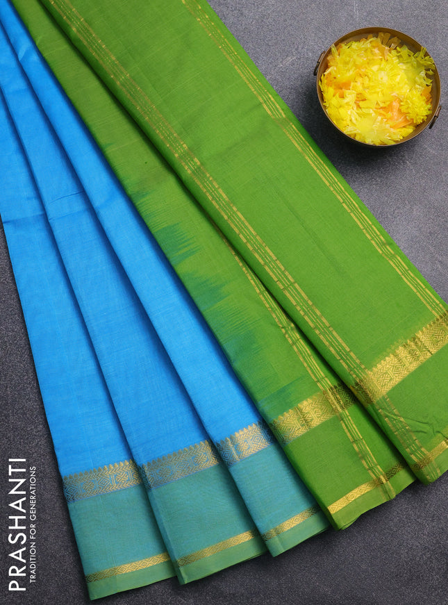 Silk cotton saree light blue and light green with plain body and zari woven border