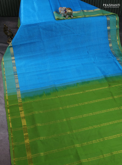 Silk cotton saree light blue and light green with plain body and zari woven border