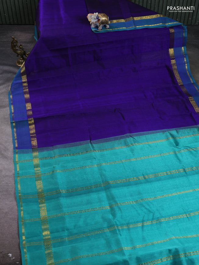 Silk cotton saree dark blue and teal green with plain body and rettapet zari woven border