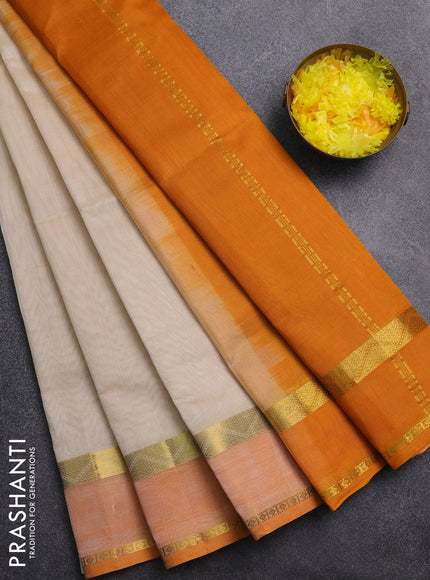 Silk cotton saree cream and mango yellow with plain body and rettapet zari woven border