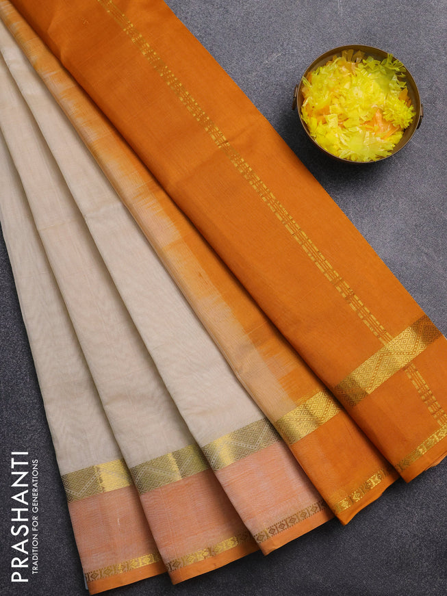 Silk cotton saree cream and mango yellow with plain body and rettapet zari woven border