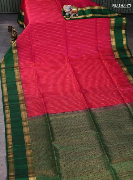 Pure soft silk saree dual shade of pinkish orange and green with allover zari weaves and rettapet zari woven border
