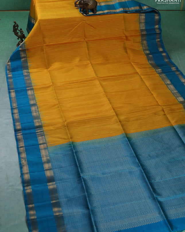 Pure soft silk saree mustard yellow and teal blue with allover zari weaves and rettapet zari woven border