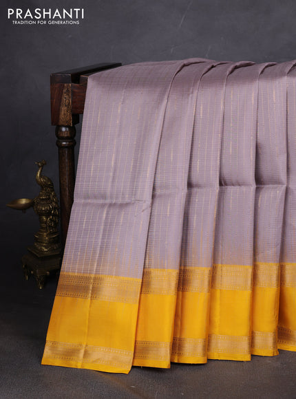 Pure soft silk saree grey and yellow with allover zari weaves and rettapet zari woven border
