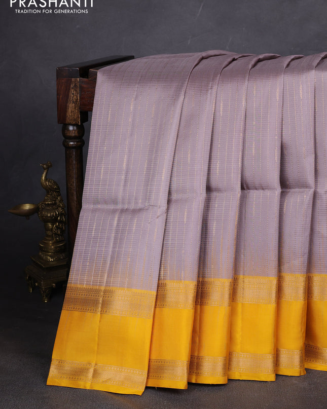Pure soft silk saree grey and yellow with allover zari weaves and rettapet zari woven border