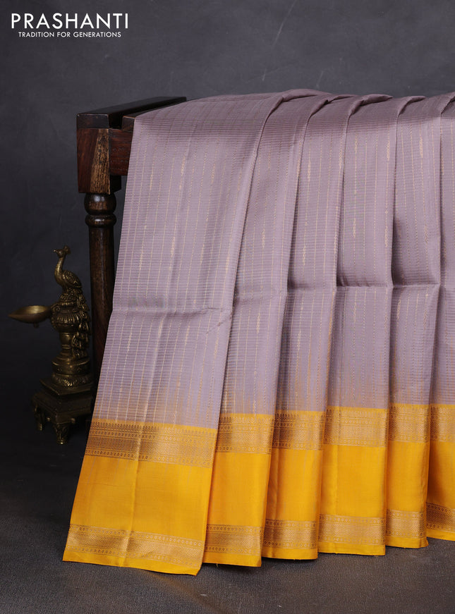 Pure soft silk saree grey and yellow with allover zari weaves and rettapet zari woven border