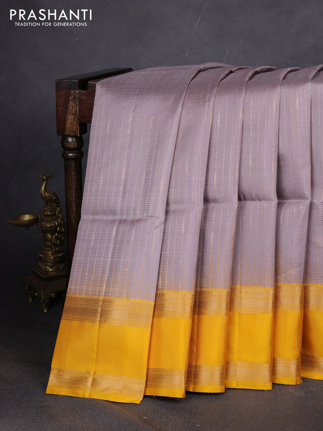 Pure soft silk saree grey and yellow with allover zari weaves and rettapet zari woven border