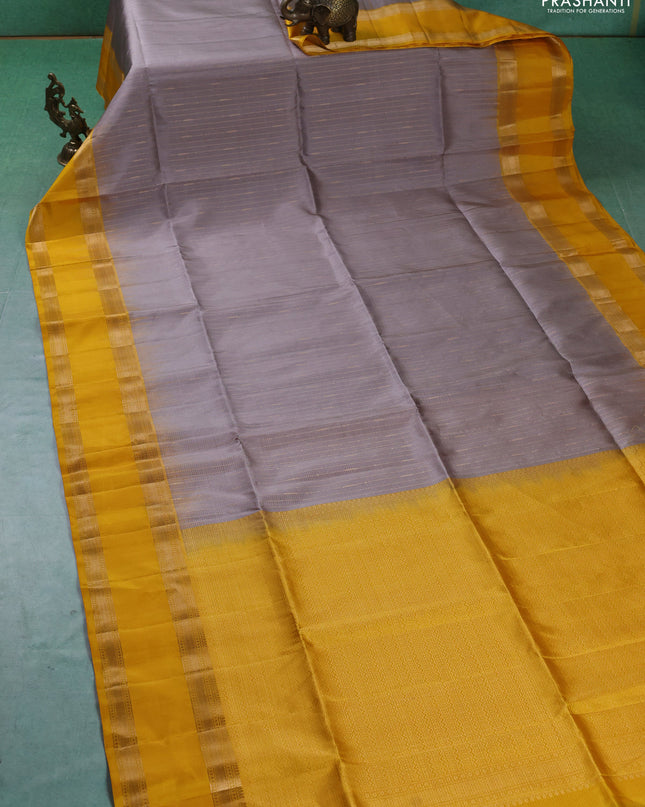 Pure soft silk saree grey and yellow with allover zari weaves and rettapet zari woven border