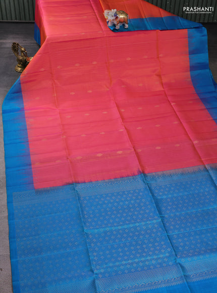 Pure soft silk saree dual shade of pinkish orange and cs blue with allover zari weaves and simple border