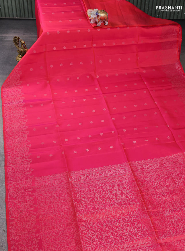 Pure soft silk saree dual shade of pinkish orange with silver zari woven buttas and rich silver zari woven border