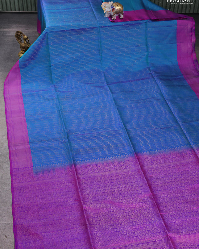 Pure soft silk saree teal blue and purple with allover zari weaves and zari woven border