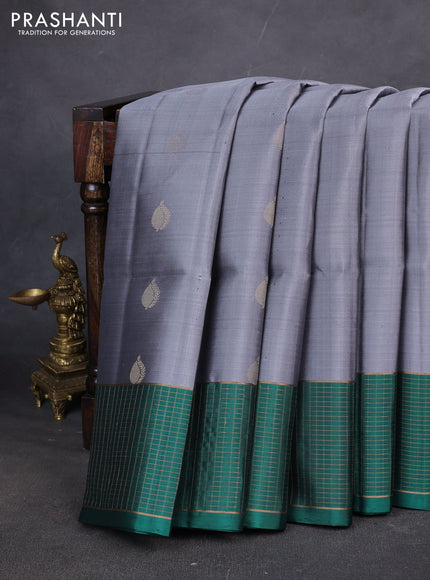 Pure soft silk saree grey and teal green with zari woven buttas and zari woven checked border