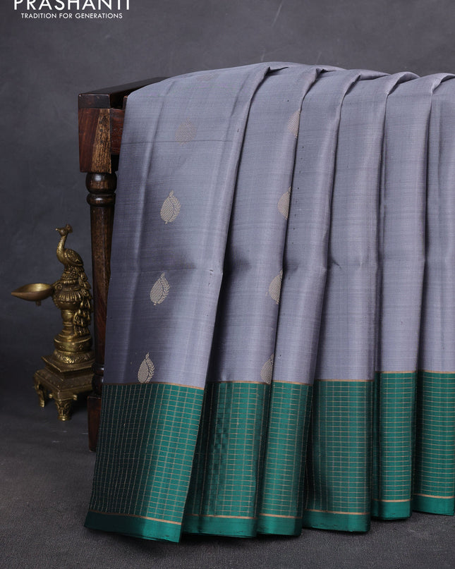 Pure soft silk saree grey and teal green with zari woven buttas and zari woven checked border