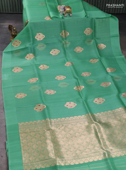Pure banarasi Organza silk saree pastel green with zari woven buttas in borderless style