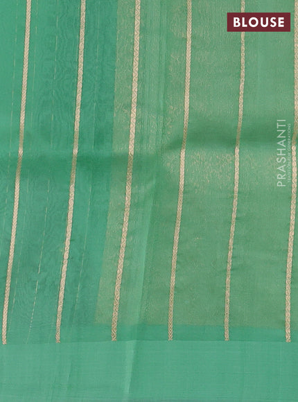 Pure banarasi Organza silk saree pastel green with zari woven buttas in borderless style