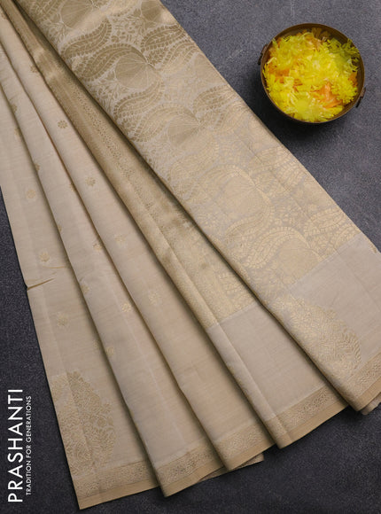 Semi raw silk saree cream with zari woven buttas and zari woven border