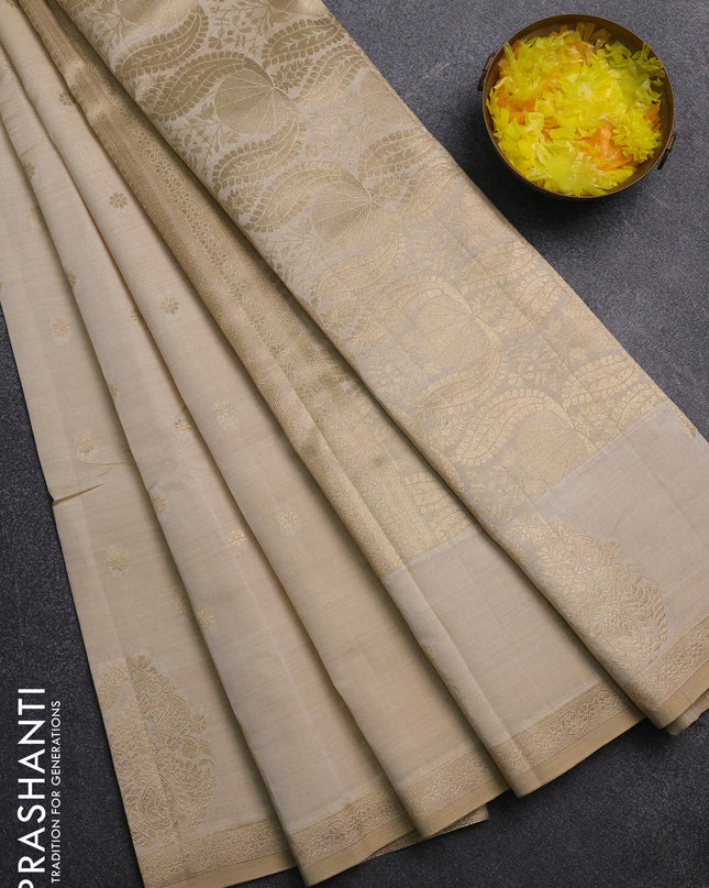 Semi raw silk saree cream with zari woven buttas and zari woven border