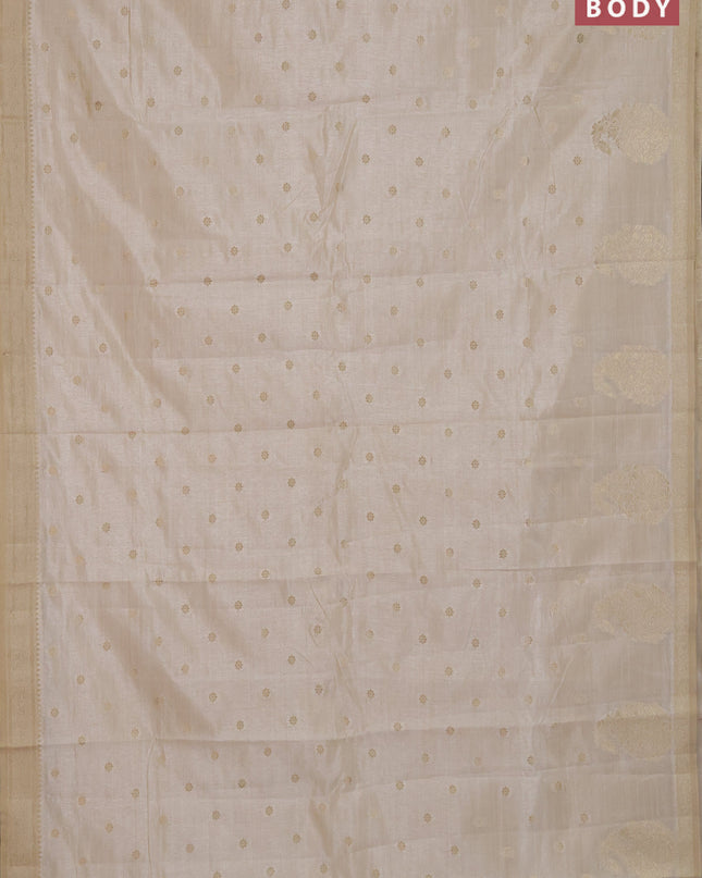 Semi raw silk saree cream with zari woven buttas and zari woven border