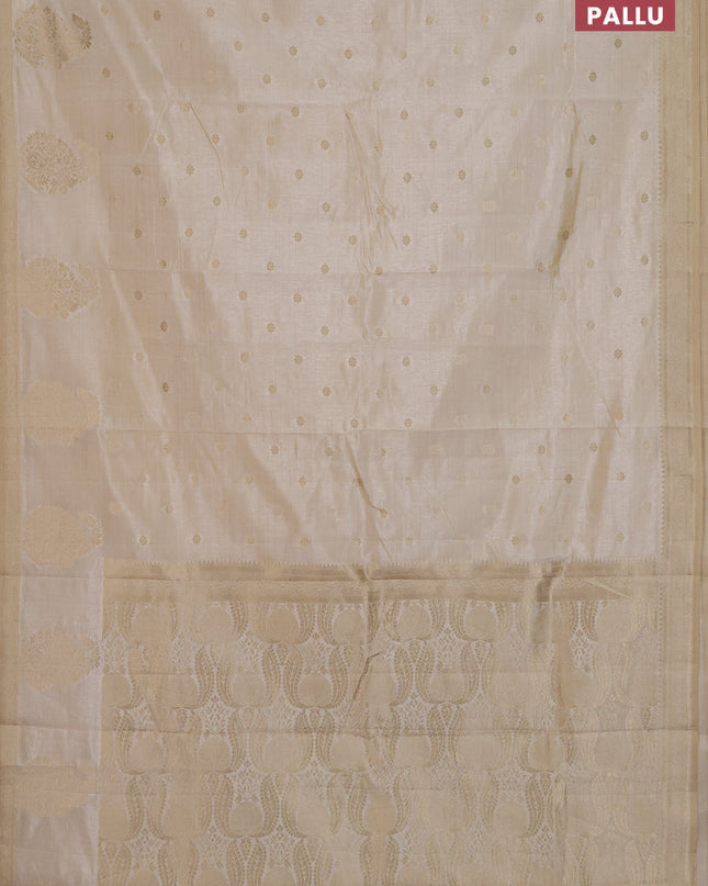 Semi raw silk saree cream with zari woven buttas and zari woven border
