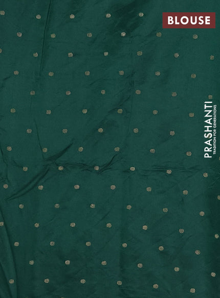 Semi raw silk saree dark green with zari woven buttas and zari woven border