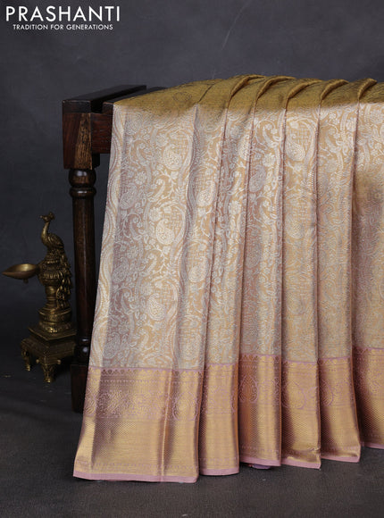 Pure kanchipuram silk saree gold and peach shade with allover zari woven brocade weaves and zari woven border