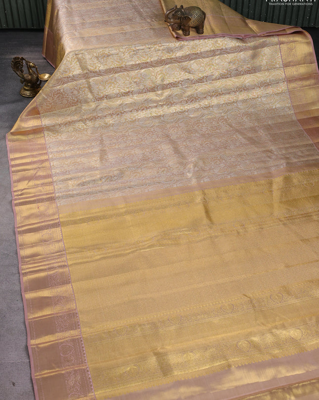 Pure kanchipuram silk saree gold and peach shade with allover zari woven brocade weaves and zari woven border