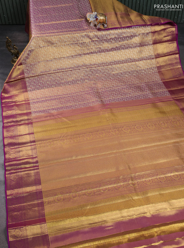 Pure kanchipuram silk saree dual shade of gold and purple with allover zari woven brocade weaves and zari woven border