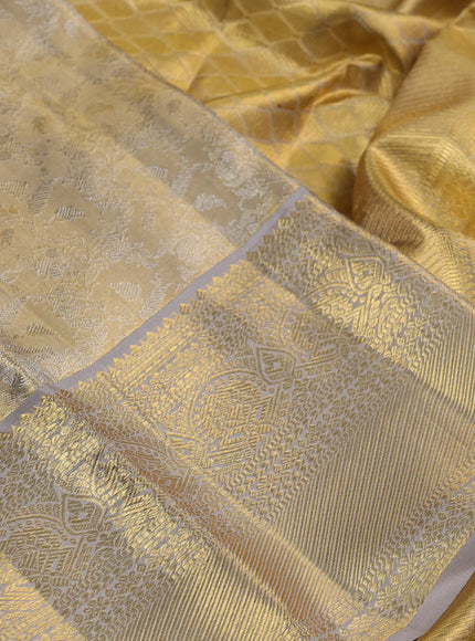 Pure kanchipuram silk saree gold and grey with allover zari woven brocade weaves and zari woven border