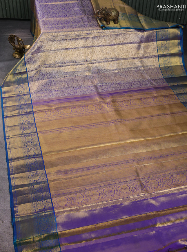 Pure kanchipuram silk saree blue shade and peacock blue with allover zari woven brocade weaves and zari woven border