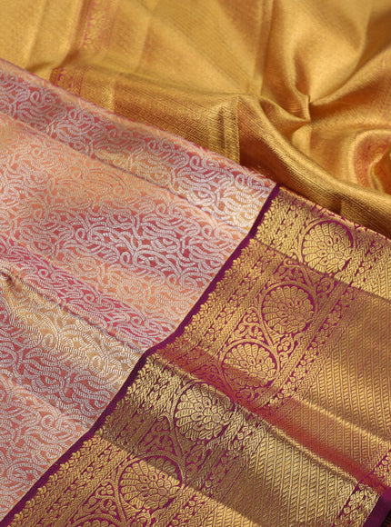 Pure kanchipuram silk saree dual shade of gold and purple with allover zari woven brocade weaves and zari woven border