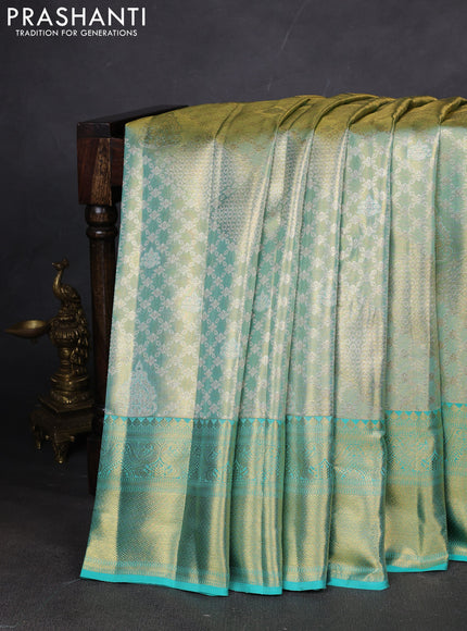Pure kanchipuram silk saree teal blue with allover zari woven brocade weaves and zari woven border