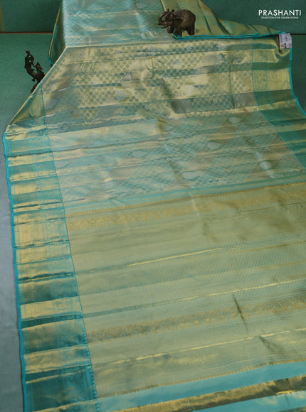 Pure kanchipuram silk saree teal blue with allover zari woven brocade weaves and zari woven border