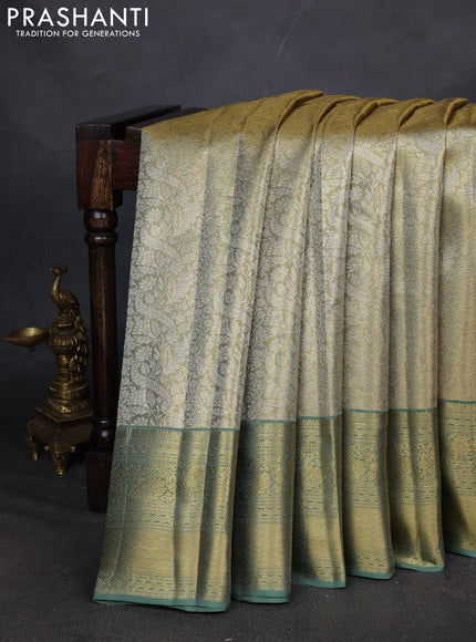 Pure kanchipuram silk saree green shade with allover zari woven brocade weaves and zari woven border