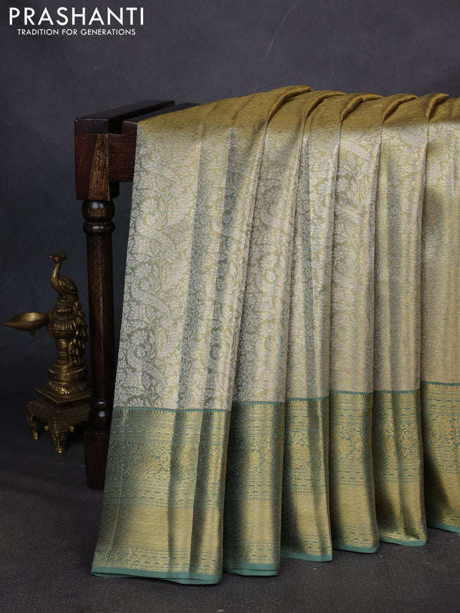 Pure kanchipuram silk saree green shade with allover zari woven brocade weaves and zari woven border