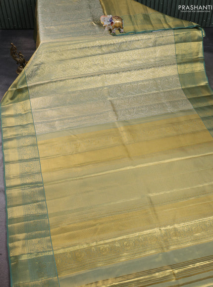 Pure kanchipuram silk saree green shade with allover zari woven brocade weaves and zari woven border