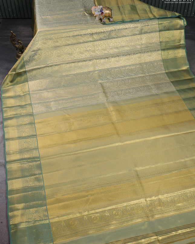Pure kanchipuram silk saree green shade with allover zari woven brocade weaves and zari woven border