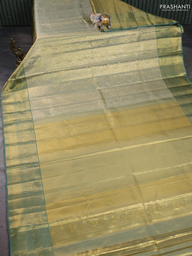 Pure kanchipuram silk saree green shade with allover zari woven brocade weaves and zari woven border