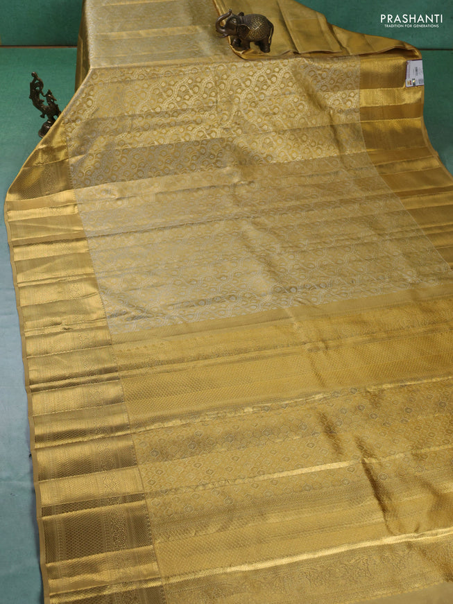 Pure kanchipuram silk saree sandal with allover zari woven brocade weaves and zari woven border