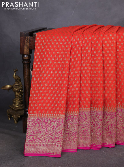 Pure Banarasi georgette saree orange and pink with allover woven buttas and woven border