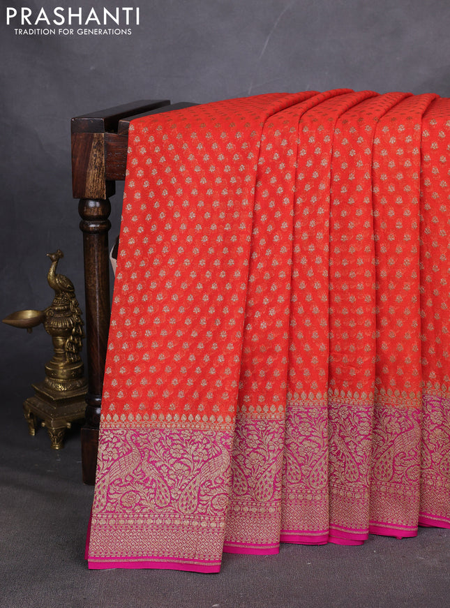 Pure Banarasi georgette saree orange and pink with allover woven buttas and woven border