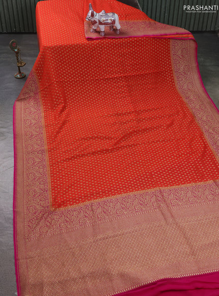 Pure Banarasi georgette saree orange and pink with allover woven buttas and woven border
