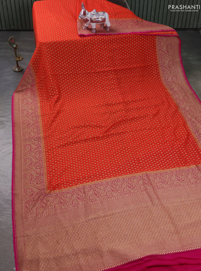 Pure Banarasi georgette saree orange and pink with allover woven buttas and woven border