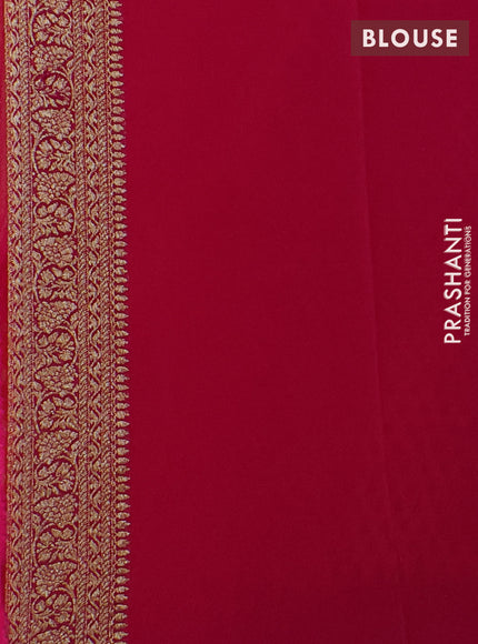 Pure Banarasi georgette saree orange and pink with allover woven buttas and woven border