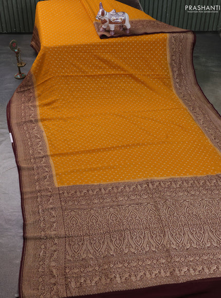 Pure Banarasi georgette saree mustard yellow and wine shade with allover woven buttas and woven border