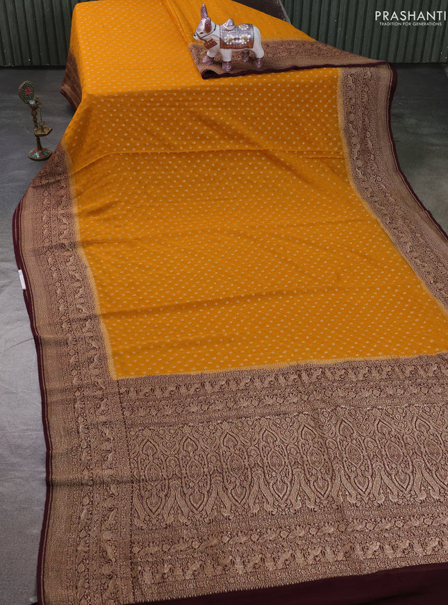Pure Banarasi georgette saree mustard yellow and wine shade with allover woven buttas and woven border