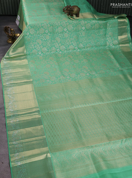 Pure kanchipuram silk saree teal green with allover zari woven brocade weaves and long zari woven border