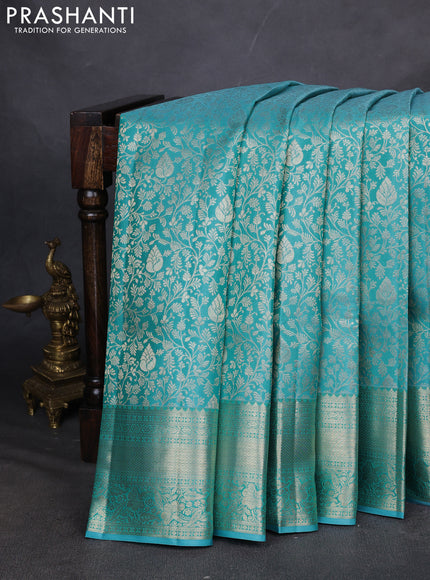 Pure kanchipuram silk saree teal blue with allover zari woven brocade weaves and zari woven border